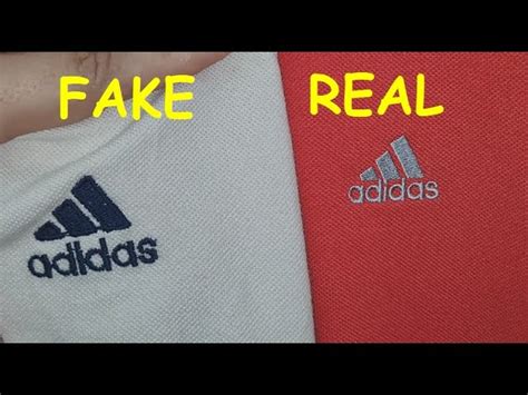 adidas human race chalk choral fake vs real|Adidas logo vs real.